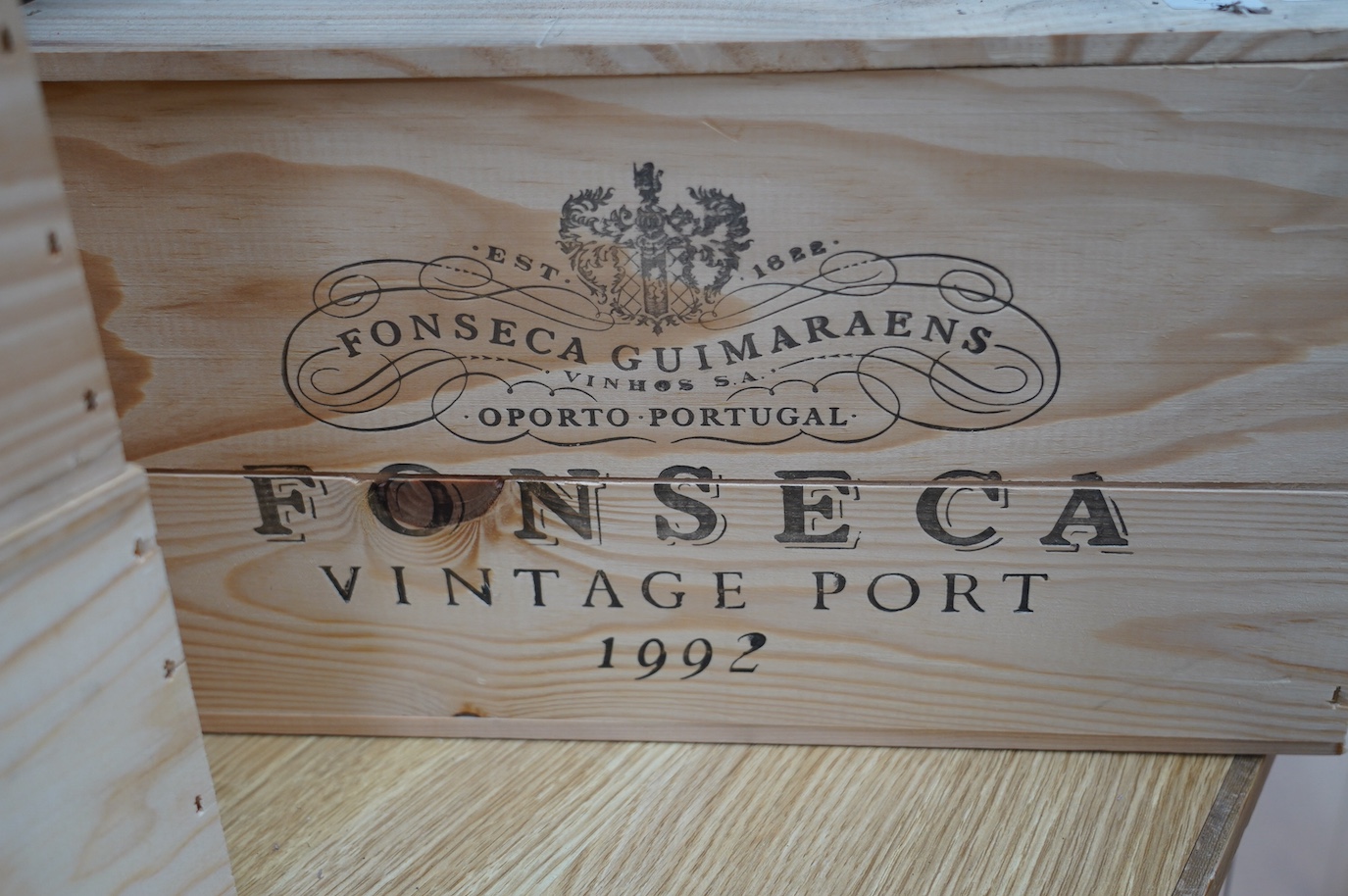 Two sealed wood cases of twelve bottles (twenty-four bottles) of 1992 Fonseca Vintage Port, in OWC's, purchased en primeur from The Wine Society. Condition - good